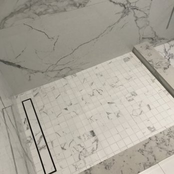 John Man Construction - a bathroom with a marble shower - General Contractors Near Me - Glendale, California John Man Construction - a bathroom with a marble shower - General Contractors Near Me - Glendale, California