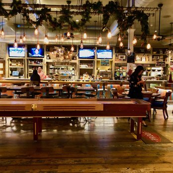 Proof - inside with a shuffleboard - American Near Me - Scottsdale, Arizona Proof - inside with a shuffleboard - American Near Me - Scottsdale, Arizona