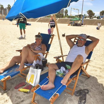 McGee Beach - This shade is saving this couple. It's hot - Beaches Near Me - Corpus Christi, Texas