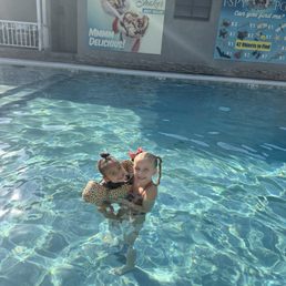 Kids in pool with crawdad