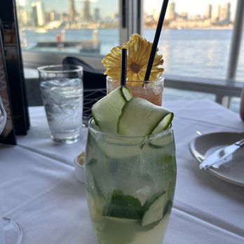 Peohe's - Foreground: cucumber Mint gin Background: Caged Tiki - Seafood Near Me - Coronado, California Peohe's - Foreground: cucumber Mint gin Background: Caged Tiki - Seafood Near Me - Coronado, California