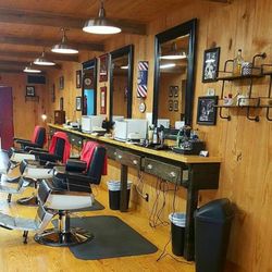 Glenn's Barber Shop On Main - Work stations and back bar.