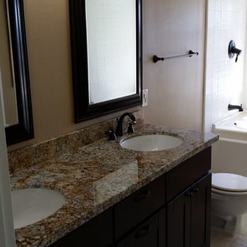 Total Property Solutions - a bathroom with granite counter tops - Property Management Near Me - Concord, California Total Property Solutions - a bathroom with granite counter tops - Property Management Near Me - Concord, California