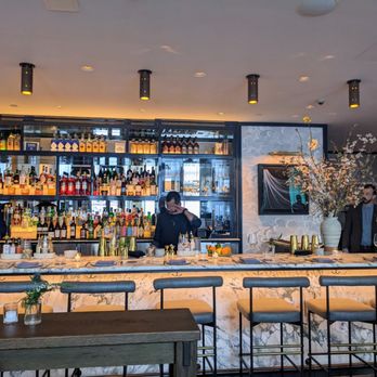 Greywind - a bar with people behind it - Wine Bars Near Me - New York, New York Greywind - a bar with people behind it - Wine Bars Near Me - New York, New York