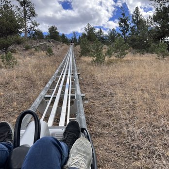 Mustang Mountain Coaster - Going up, in front of us. - Amusement Parks Near Me - Estes Park, Colorado Mustang Mountain Coaster - Going up, in front of us. - Amusement Parks Near Me - Estes Park, Colorado
