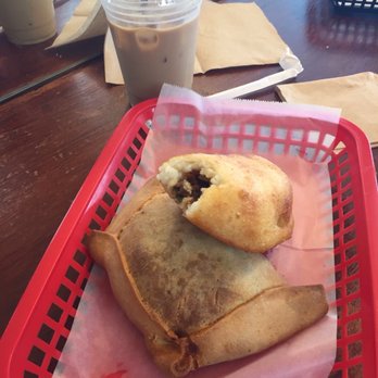 Charlotte Bakery - Carne y cilantro empanada on top with beef,olive,egg on bottom. - Bakeries Near Me - Miami Beach, Florida