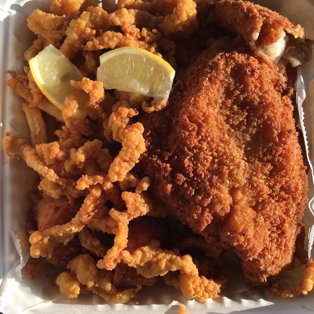 The Clam Castle - Golden fried seafood combo platter (on top the clam strips and cod are most clearly visible) - Seafood Near Me - Madison, Connecticut The Clam Castle - Golden fried seafood combo platter (on top the clam strips and cod are most clearly visible) - Seafood Near Me - Madison, Connecticut
