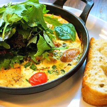 Medina Cafe - Frittata: showcasing seasonal ingredients with grilled focaccia ($18). - Breakfast & Brunch Near Me - Vancouver, British Columbia Medina Cafe - Frittata: showcasing seasonal ingredients with grilled focaccia ($18). - Breakfast & Brunch Near Me - Vancouver, British Columbia