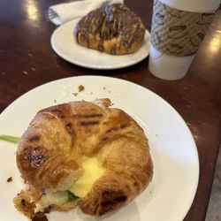 Navah Coffee House - Chocolate croissant and egg bacon cheese and spinach on a flaky croissant