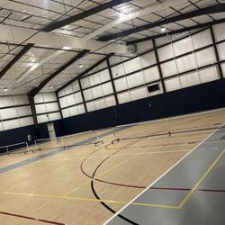 GoLive Event Center - Indoor gym set up with 3 pickleball courts within the GoLive Event Center