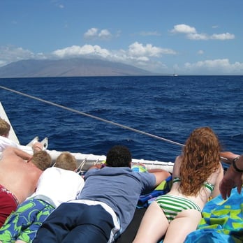 Sail Maui- Maalaea - People laying down on the trampolines.  They all got soaked on the way back from Molokini. - Boat Charters Near Me - Maalaea, Hawaii