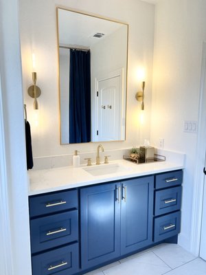Bathroom Design and Remodel 2022 - This was a complete remodel design. New cabinets, flooring, shower design, custom shower curtain, light fixtures and accessories were selected for this space. Bathroom Design and Remodel 2022 - This was a complete remodel design. New cabinets, flooring, shower design, custom shower curtain, light fixtures and accessories were selected for this space.
