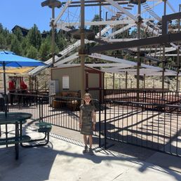 My almost 8 year old after the ropes course. She did the zip line portion too!