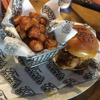 Ford's Garage Dearborn - Fried chicken sandwich w/ sweet potato tots - Burgers Near Me - Dearborn, Michigan Ford's Garage Dearborn - Fried chicken sandwich w/ sweet potato tots - Burgers Near Me - Dearborn, Michigan