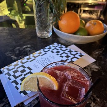 Alive & Well - a glass of juice with a slice of lemon - Cocktail Bars Near Me - Cincinnati, Ohio Alive & Well - a glass of juice with a slice of lemon - Cocktail Bars Near Me - Cincinnati, Ohio