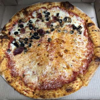 Mario's Italian Grill - Large bacon, mushrooms and black olives that showed up with only toppings on half - Pizza Near Me - Charleston, South Carolina