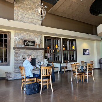 Summit Coffee - a man sitting at a table in a coffee shop - Coffee & Tea Near Me - Bakersfield, California