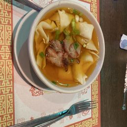 A small won ton soup. Note the deeper colored broth and lots of contents. A small won ton soup. Note the deeper colored broth and lots of contents.
