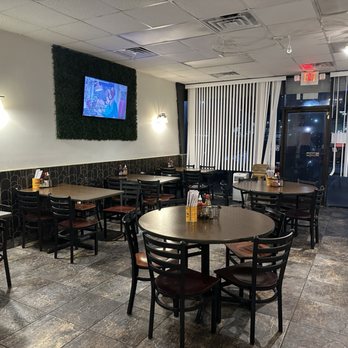Little Saigon Cafe - tables and chairs and a flat screen tv - Vietnamese Near Me - Orange Park, Florida Little Saigon Cafe - tables and chairs and a flat screen tv - Vietnamese Near Me - Orange Park, Florida
