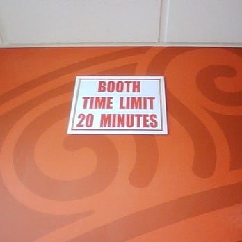 Dunkin'  -  a sign that reads booth time limit 20 minutes - Donuts Near Me - Rockville Centre, New York
