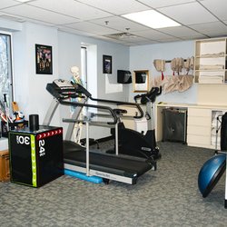 MOTION Sports Medicine - New City - Rehab space at MOTION New City featuring treadmill, resistance bands, plyo box, BOSU, and therapeutic tools for personalized physical therap