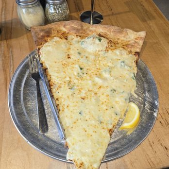 Lazy Moon - Saganaki Slice  $7.50  Ricotta, Fontina, Aged Cheese Blend, Lemon Zest, Parsley, Mozzarella, Lemon Wedge Side - Pizza Near Me - Maitland, Florida