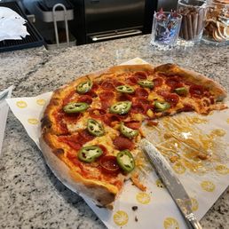 Kai pizza.  A loaded pepperoni pizza with pickled fresh jalapeños and some charred pineapple (needed more)