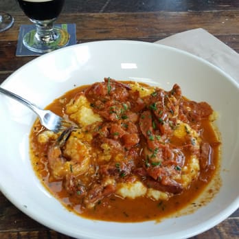 Union Kitchen and Tap Encinitas - Shrimp and grits with andoulli sausage. . And of course, a nice guineas stout. - New American Near Me - Encinitas, California Union Kitchen and Tap Encinitas - Shrimp and grits with andoulli sausage. . And of course, a nice guineas stout. - New American Near Me - Encinitas, California