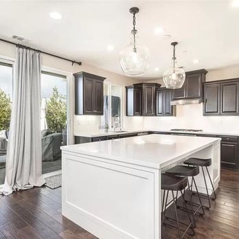 Rudio Designz - a kitchen with a large island - Flooring Near Me - Valencia, California Rudio Designz - a kitchen with a large island - Flooring Near Me - Valencia, California