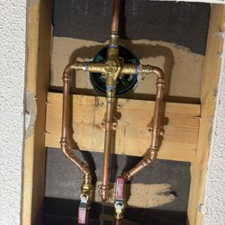 Kobella Plumbing Heating Cooling - New plumbing including the shower valve, copper tubing, and shutoff valves.
