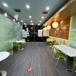 a large conference room with tables and chairs