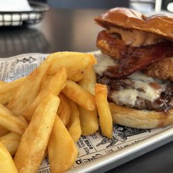 Nomads Proper Burgers - HODO Burger Double smash of meat, gouda cheese, bacon, fried camebert, raspberry jam and capo sauce.