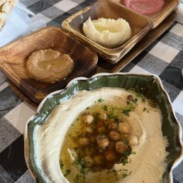 Hummus with complimentary pita bread and appetizer dips.  Delicious!