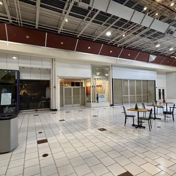 Beaver Valley Mall - Empty storefronts, trash can, and some seating - Shopping Centers Near Me - Monaca, Pennsylvania