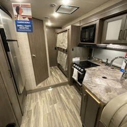 Northland Camper Rental - Four Winds Class C - purchased Fall of 2024 - Kitchen with hallway bunks
