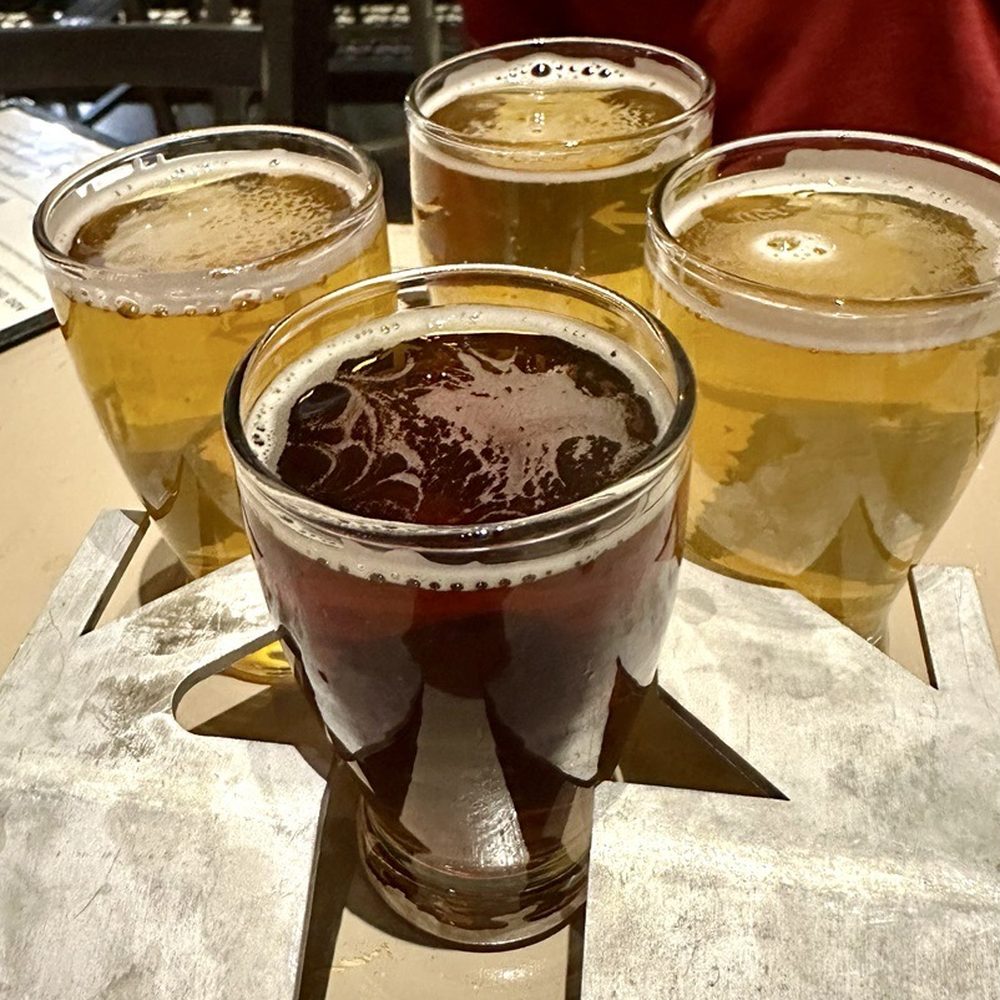 Crux Fermentation Project - Beer flight! Mostly IPAs, but that front one was a super interesting chai spiced brown ale. Weirdly good. - Brewpubs Near Me - Portland, Oregon