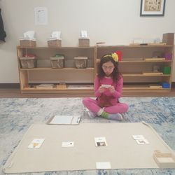 Guidepost Montessori at Downtown Naperville - My daughter doing a reading work