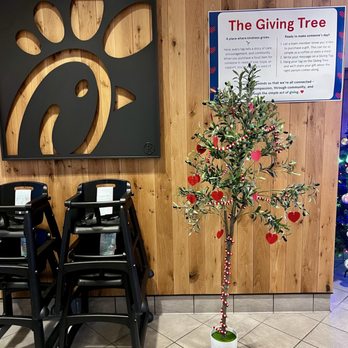 Chick-fil-A - The 'Giving Tree' where you can purchase a meal or even just a cup of coffee for someone who needs it to 'pay-it-forward'.  Great idea! - Fast Food Near Me - Irvine, California