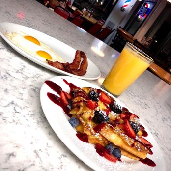Cruz's Cafe - two plates of food and a glass of orange juice - Breakfast & Brunch Near Me - Cedar Rapids, Iowa