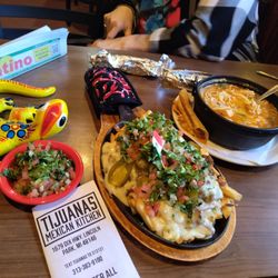 Tijuana's Mexican Kitchen - I named this Mexican Poutine OMG, it's loaded fries topped with Chunky Beef. Absolutely a must try, just ask for it .