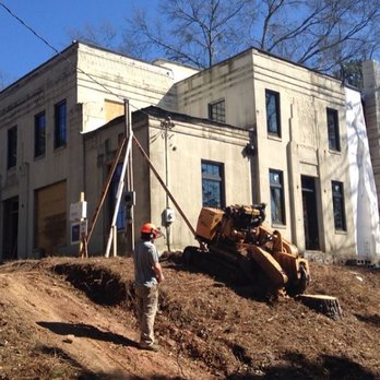 Tree Stump Masters - a man standing next to a bulldozer - Landscaping Near Me - Atlanta, Georgia Tree Stump Masters - a man standing next to a bulldozer - Landscaping Near Me - Atlanta, Georgia