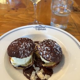 Chocolate profiteroles with vanilla ice cream and all the trimmings. Delish! Chocolate profiteroles with vanilla ice cream and all the trimmings. Delish!