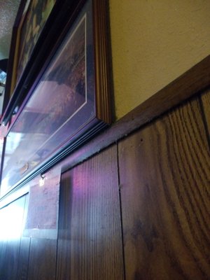 Photo of George's Bar & Grill - Cathedral City, CA, US. Dusty and sticky walls and pictures.