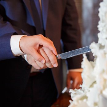 Classic Cheesecakes & Cakes - a bride and groom cutting a wedding cake - Bakeries Near Me Classic Cheesecakes & Cakes - a bride and groom cutting a wedding cake - Bakeries Near Me
