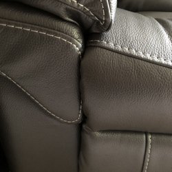 The Brick - Comparison to other side you see the seat cushion covers stitching on this side but not the other.