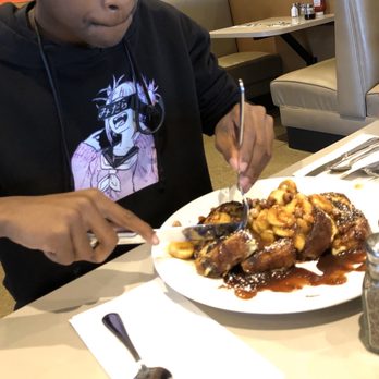 Elly's Pancake House - Nutella and banana French toast. His mouth is pressed so you know it's serious business - Breakfast & Brunch Near Me - Chicago, Illinois