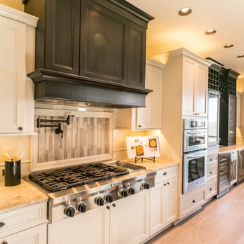 Pahlisch Homes, Inc. - a kitchen with white cabinets and black appliances - General Contractors Near Me - Richland, Washington Pahlisch Homes, Inc. - a kitchen with white cabinets and black appliances - General Contractors Near Me - Richland, Washington