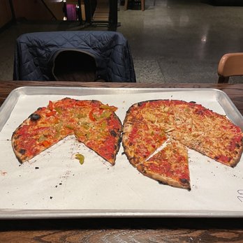 Sally’s Apizza - Tomato and Mozzarella pie w/peppers and garlic (R) and Firebird Pizza (L) - Pizza Near Me - Stamford, Connecticut Sally’s Apizza - Tomato and Mozzarella pie w/peppers and garlic (R) and Firebird Pizza (L) - Pizza Near Me - Stamford, Connecticut