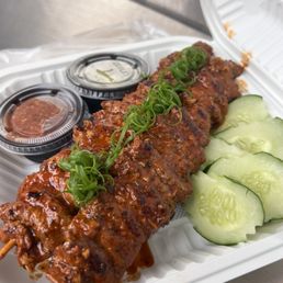 Beef skewers with sticky rice.