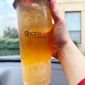 Sharetea - a person holding a cup of iced tea - Bubble Tea Near Me - Houston, Texas